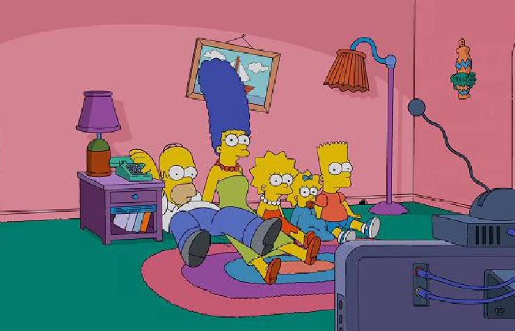 La famiglia Simpson in salotto a sedere per terra